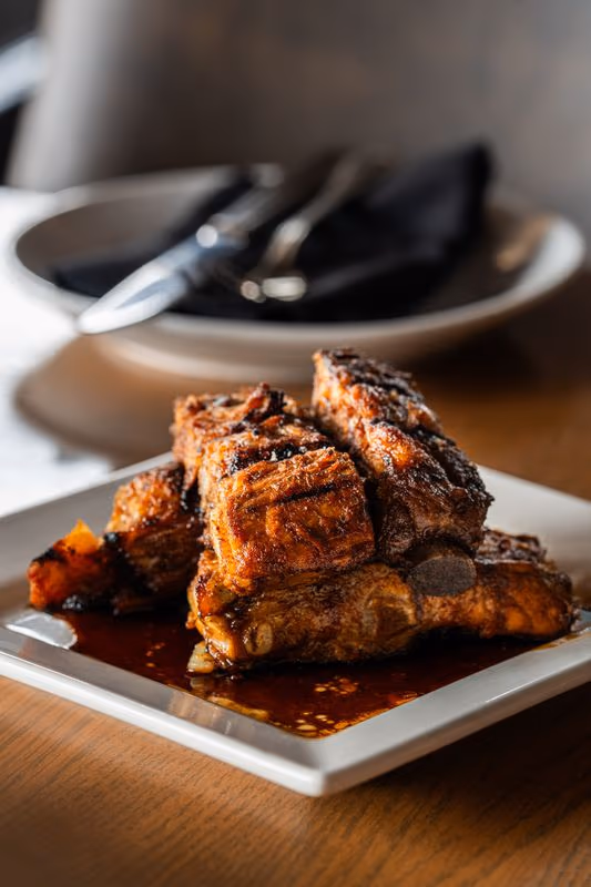 Costillas Españolas at Eclipse di Luna: grilled Spanish ribs glazed with aged balsamic vinaigrette