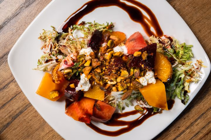 Ensalada de Remolacha at Eclipse di Luna: roasted beets with goat cheese, mandarins, pistachios, and a balsamic drizzle