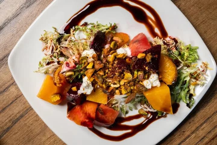 Ensalada de Remolacha at Eclipse di Luna: roasted beets with goat cheese, mandarins, pistachios, and a balsamic drizzle